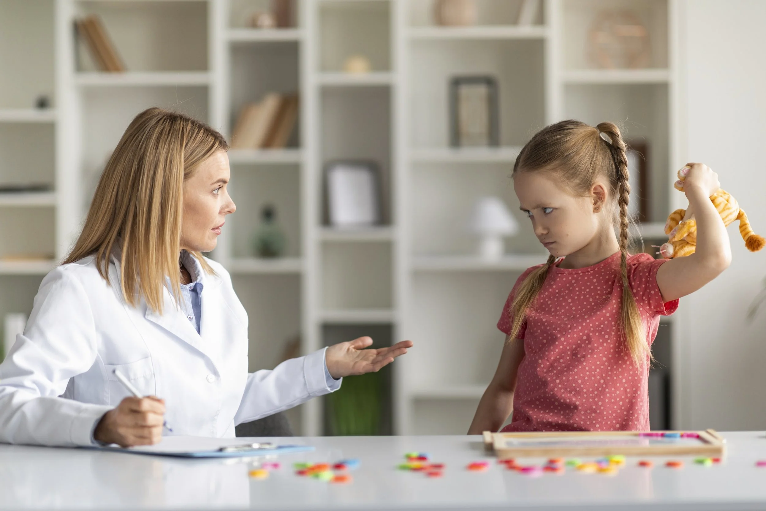 Child receiving professional anger issues therapy from a child psychologist during a counseling session in Lahore to improve emotional regulation and healthy behavior.