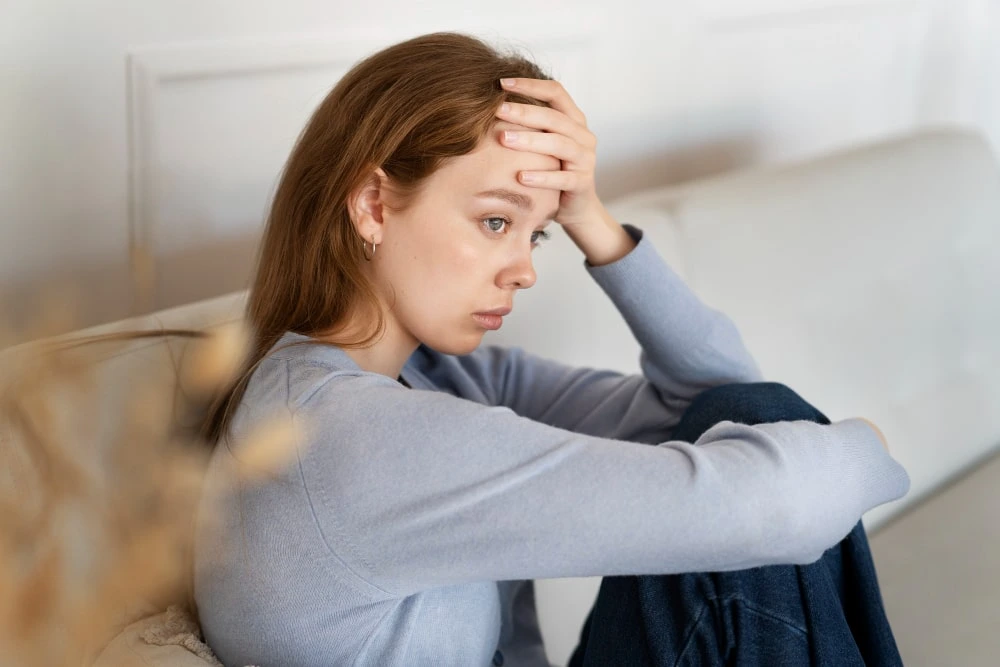 Young woman experiencing symptoms of depression and emotional distress receiving support through professional depression management therapy and mental health counseling in Lahore.
