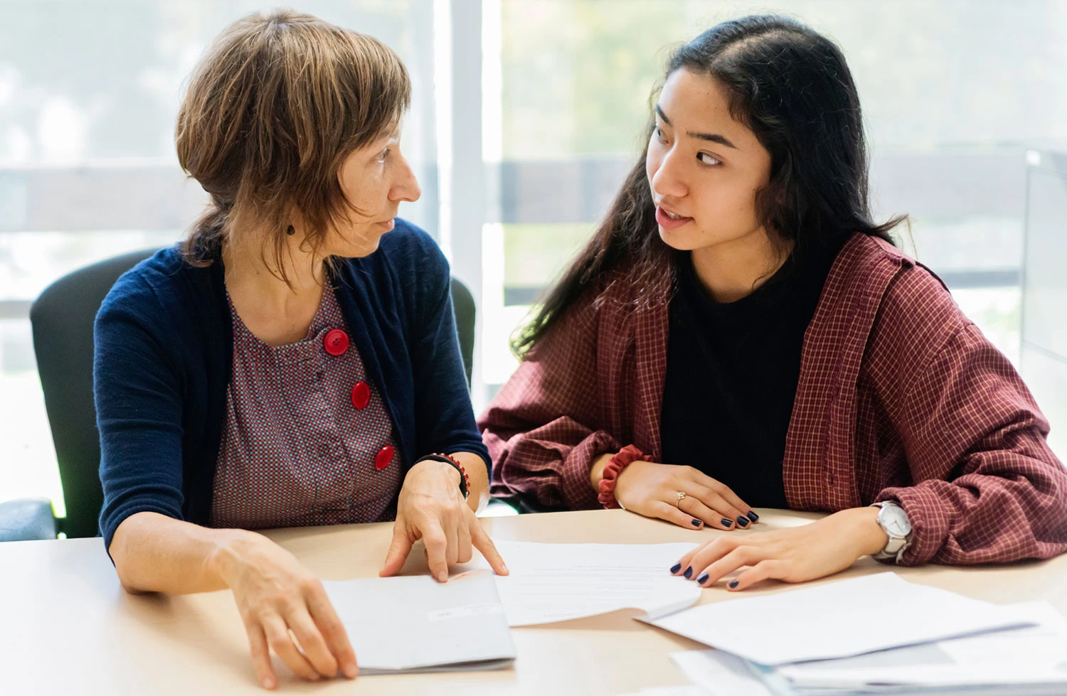 Educational counselor providing one-on-one academic guidance to a student during an educational counseling session at Care & Cure Wellness Center in Lahore.