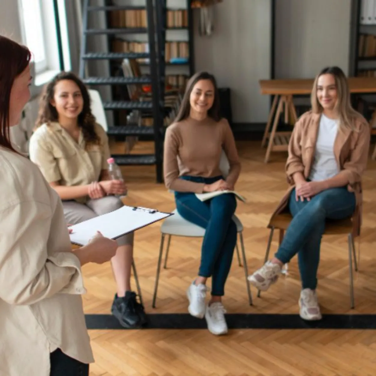 Psychology students participating in a professional clinical psychology internship training session led by an experienced psychologist in Lahore.