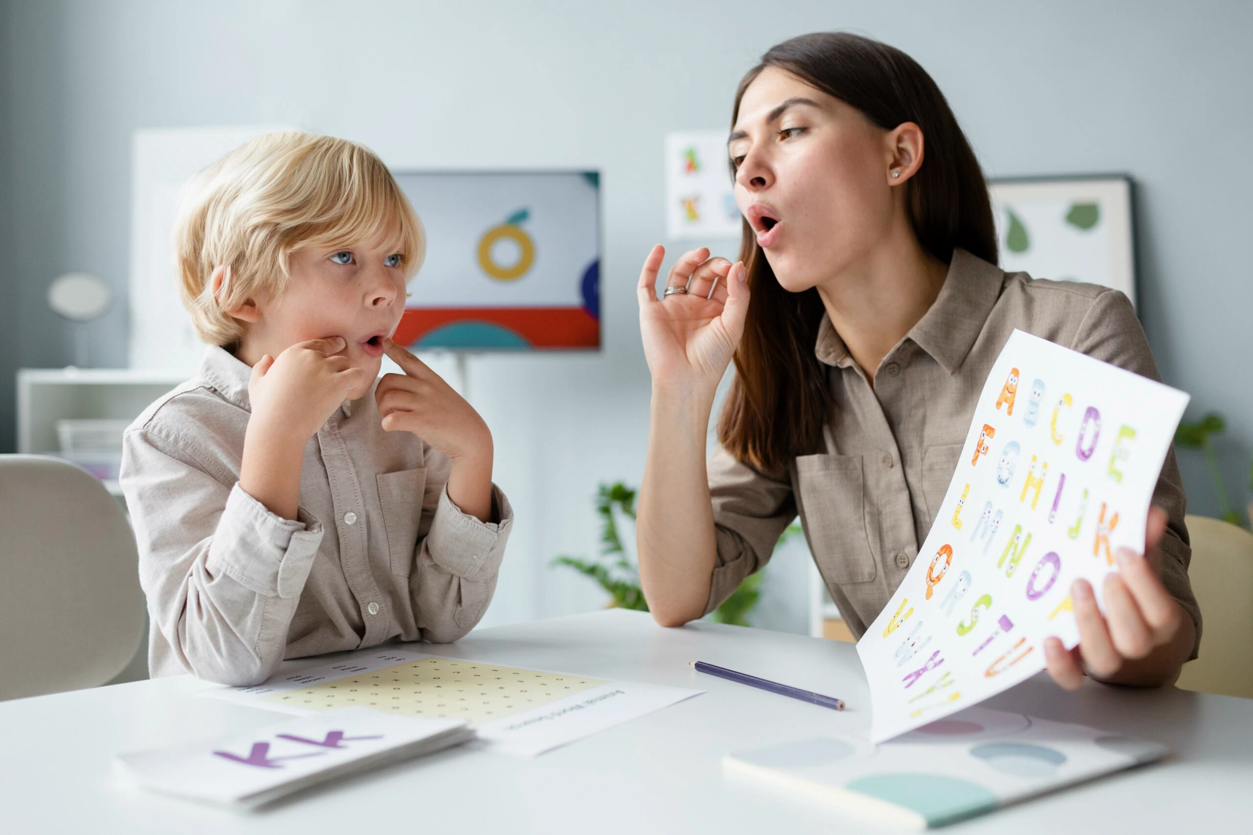 Speech therapy session with a licensed speech-language therapist helping a child improve communication, language development, pronunciation, and speech skills at Care & Cure Wellness Center in Lahore.