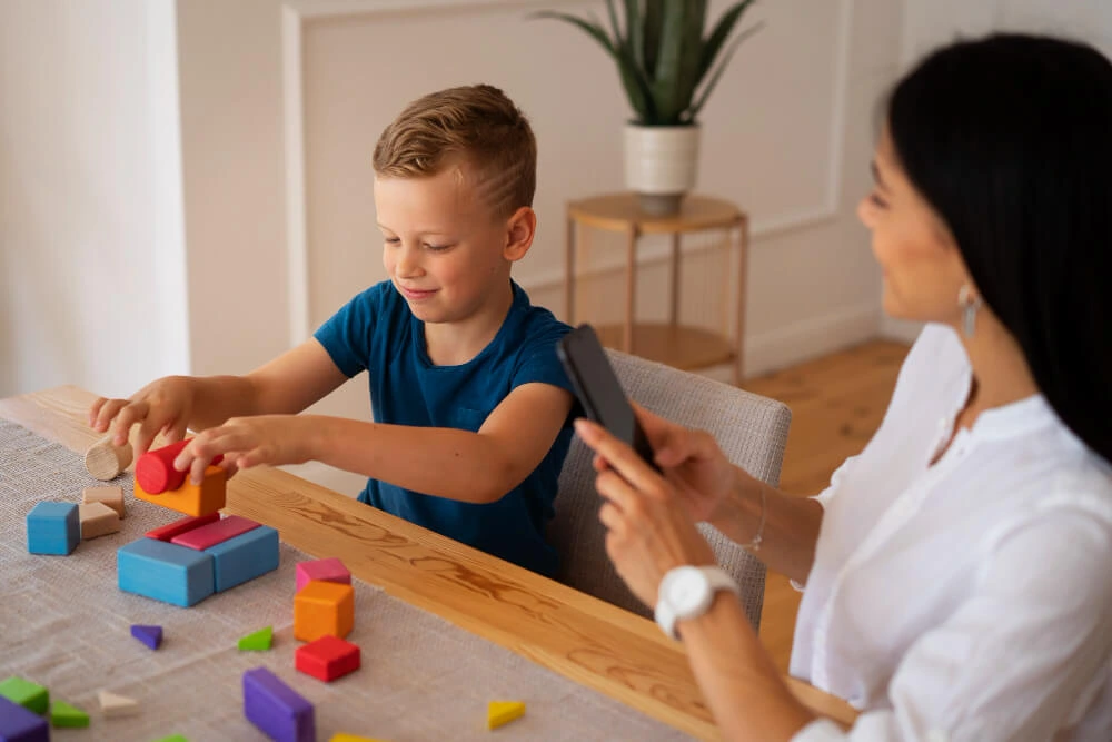 Child participating in a professional child counseling session in Lahore using educational toys and play-based activities to improve emotional, behavioral, and developmental skills under the guidance of a child psychologist.